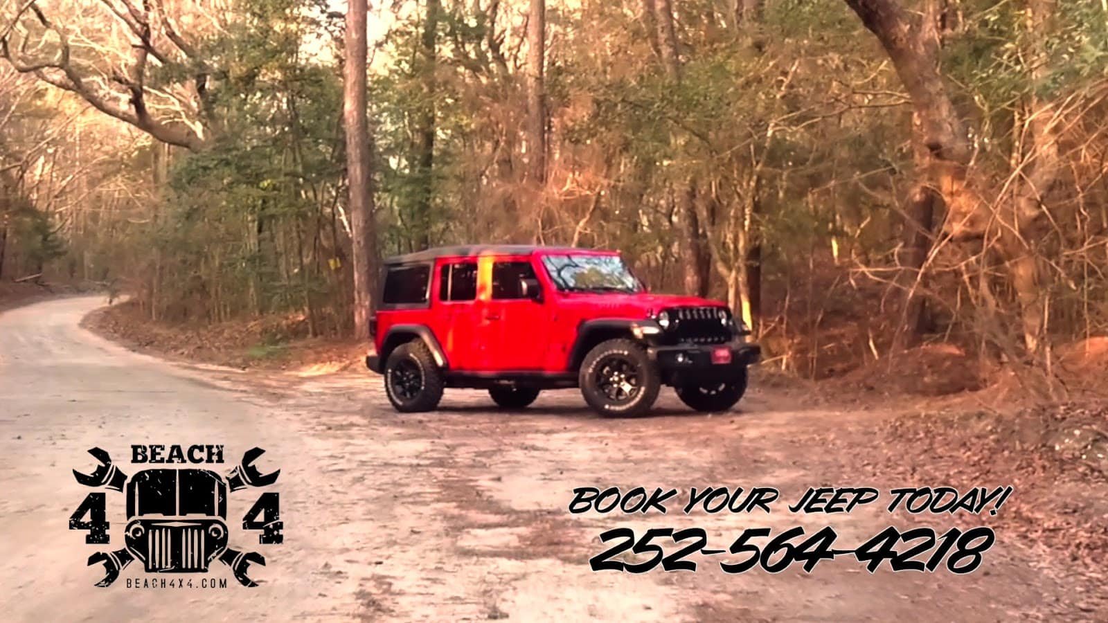 Beach4x4 red Jeep Wrangler rental on a wooded trail - 252-564-4218.